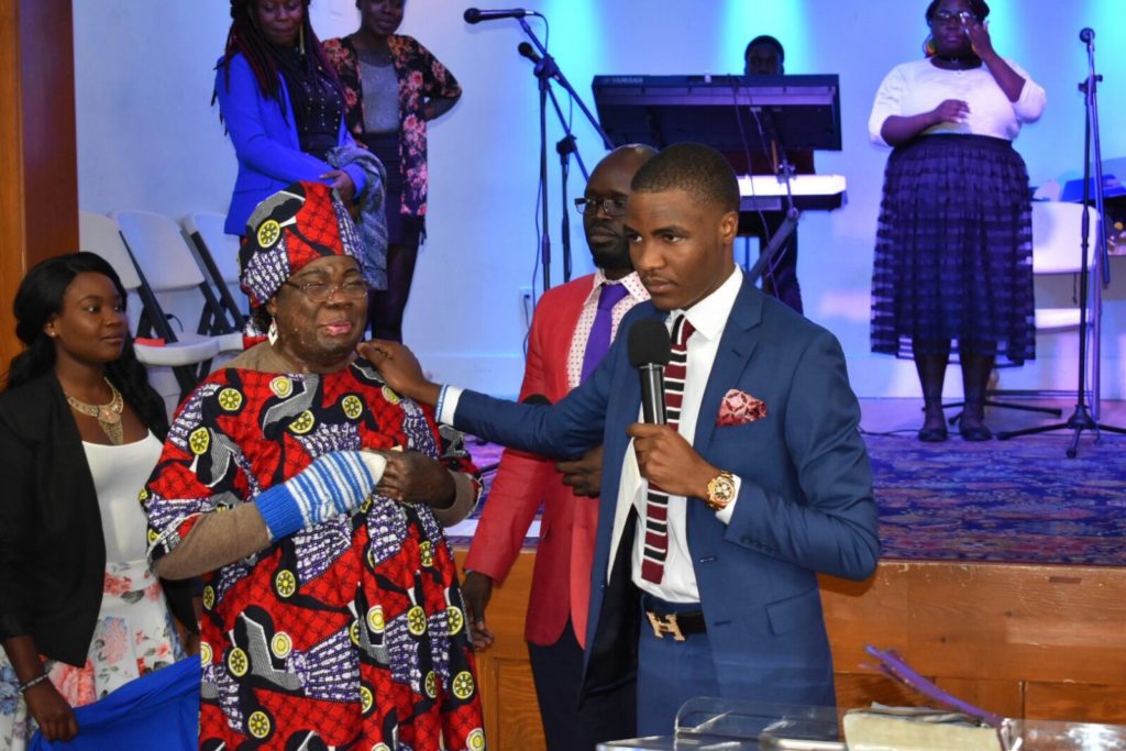 Apostle Felixosis Huios Nabi Navira and the lady whose debt was reduced from 1.8 million USD to 63 dollars testifying at ECG Portland, Maine (USA)